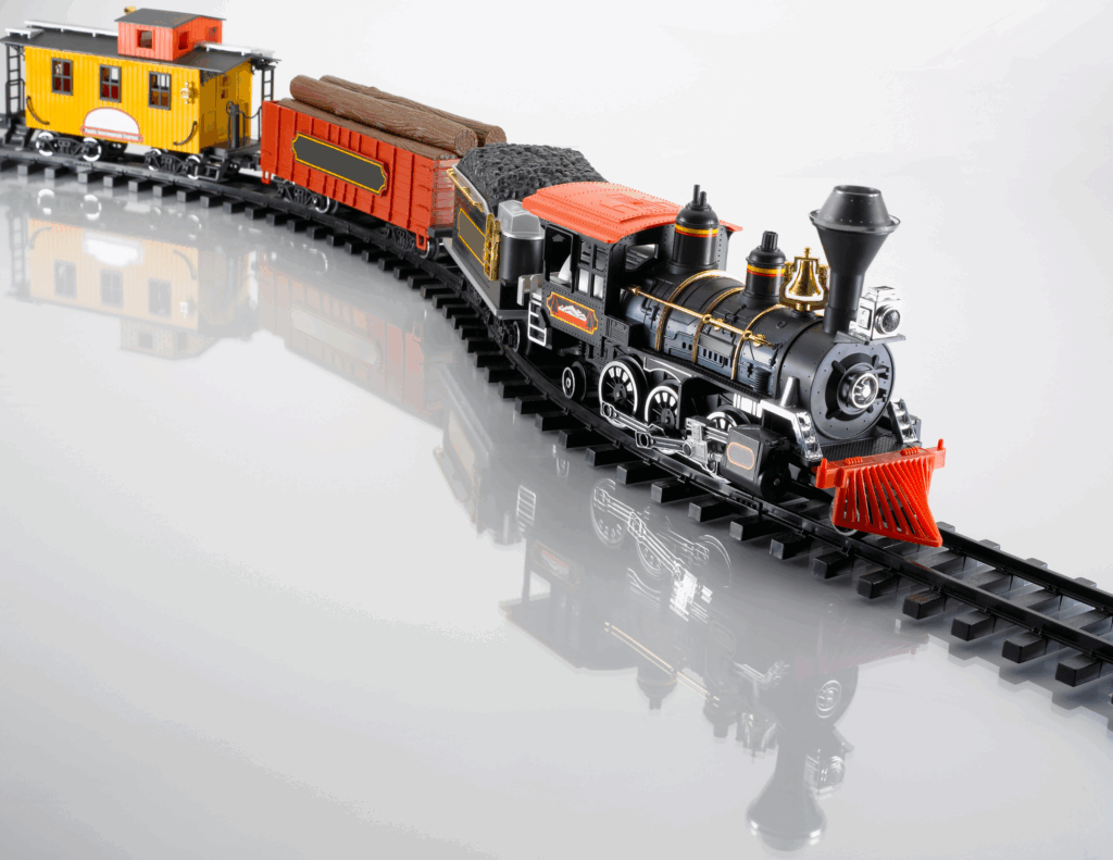Colorful toy train on a winding track, symbolizing personal transformation and emotional exploration.