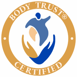 Circular gold seal with the words “Body Trust® Certified” around a stylized abstract figure and hands in shades of blue and tan.