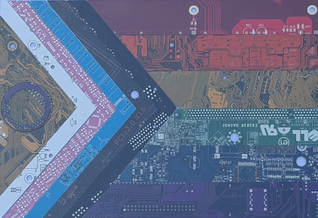 Progress Pride flag rendered in colorful circuit board textures — a photograph of an original art piece by Because Science DC, displayed in the office of Side Quest Psychotherapy in College Park, Maryland.